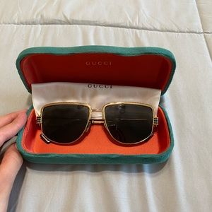 Gold Gucci sunglasses with case